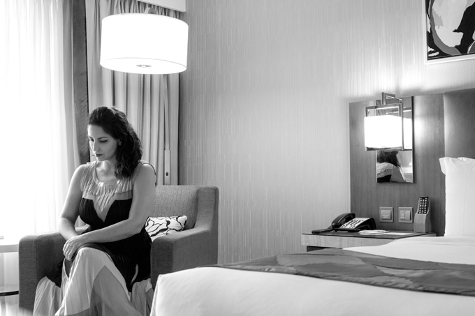 Jessica Peterson, woman in dress, in Holiday Inn Macao room