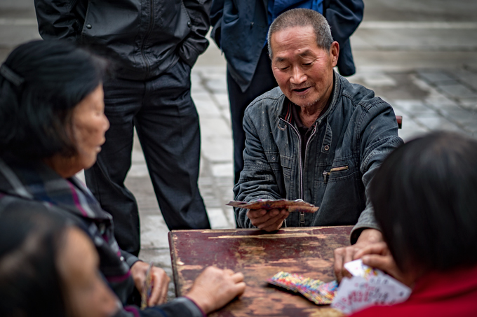Man playing cards in Zhangjiajie, China