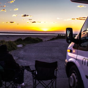 Sunset and campervans at Sunset Point, Hokitika, New Zealand