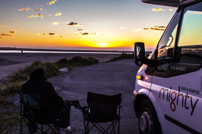 Sunset and campervans at Sunset Point, Hokitika, New Zealand