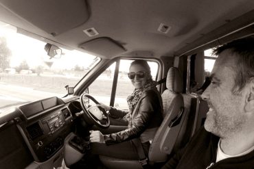 Man and woman in campervan, New Zealand. Tim and Jessica Peterson.