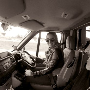 Man and woman in campervan, New Zealand. Tim and Jessica Peterson.