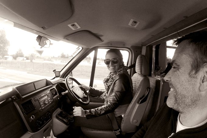 Man and woman in campervan, New Zealand. Tim and Jessica Peterson.