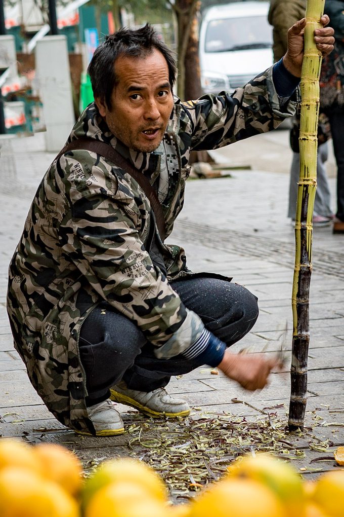 Man carving bamboo in Zhangjiajie, China