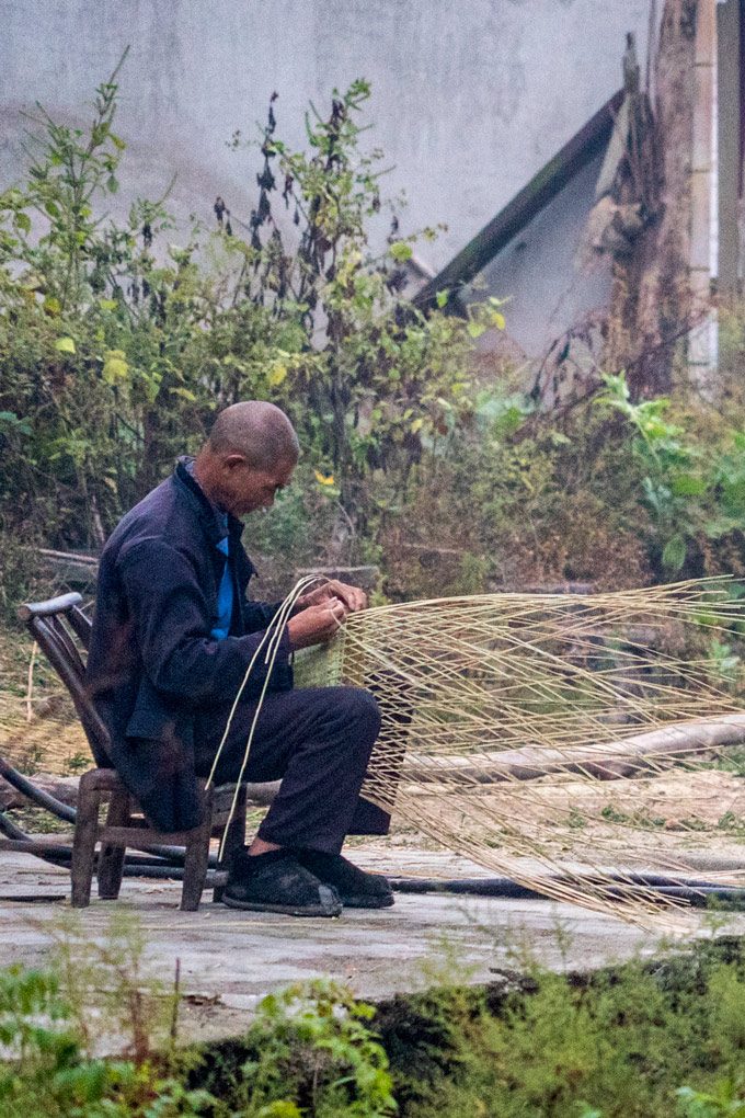 Man weaving basket in Yangjiajia, China