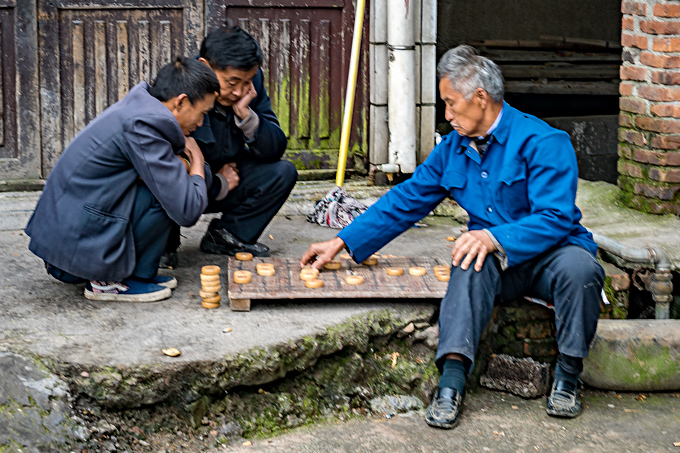 Street game of checkers in Zhangjiajie, China