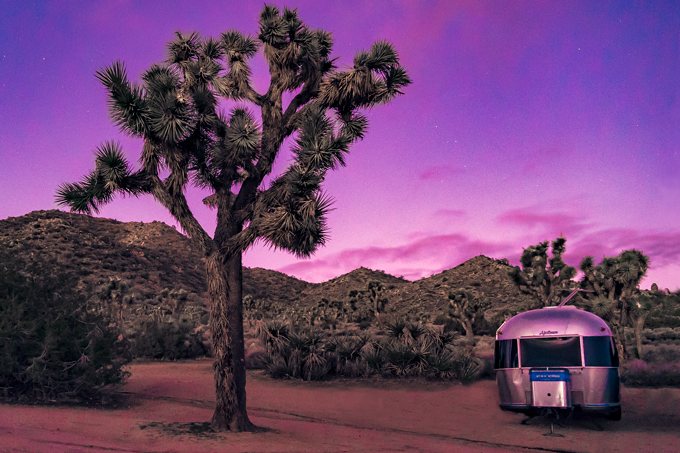Global Girl Travels Airstream Trailer at Joshua Tree National Forest Park, California during sunrise