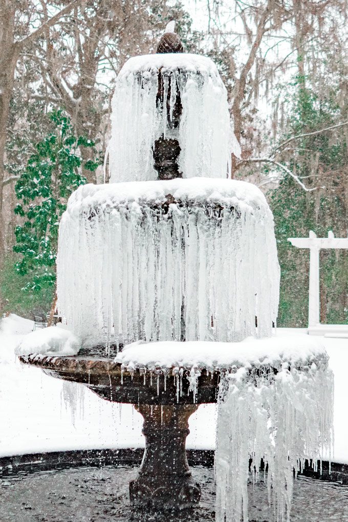 Snow at fountain at Mackey House and Red Gate Farms, Savannah, Georgia